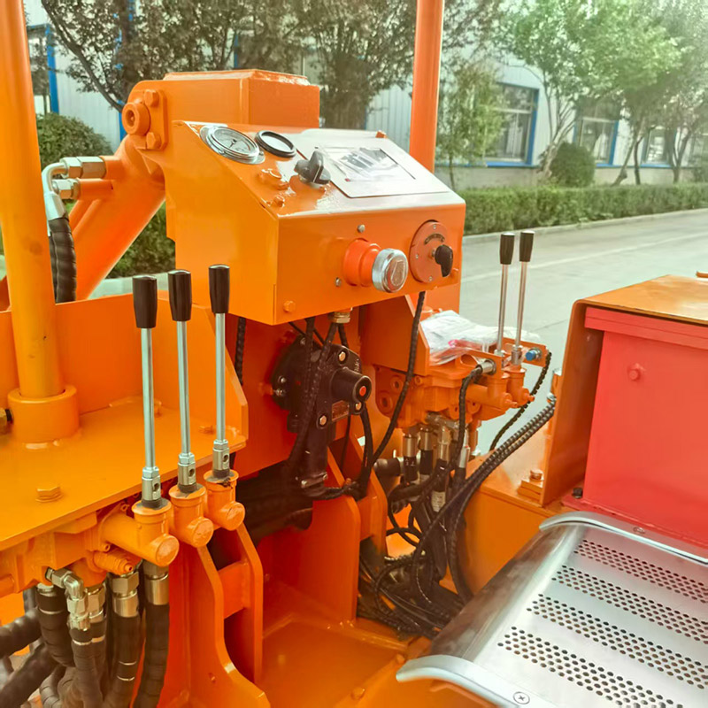 Carregador de rochas para descarga lateral em mina de carvão